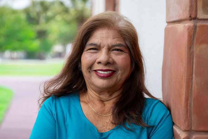 headshot of patient smiling brightly