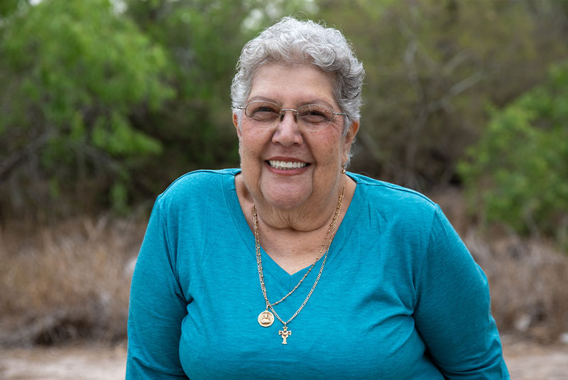 headshot of patient smiling brightly