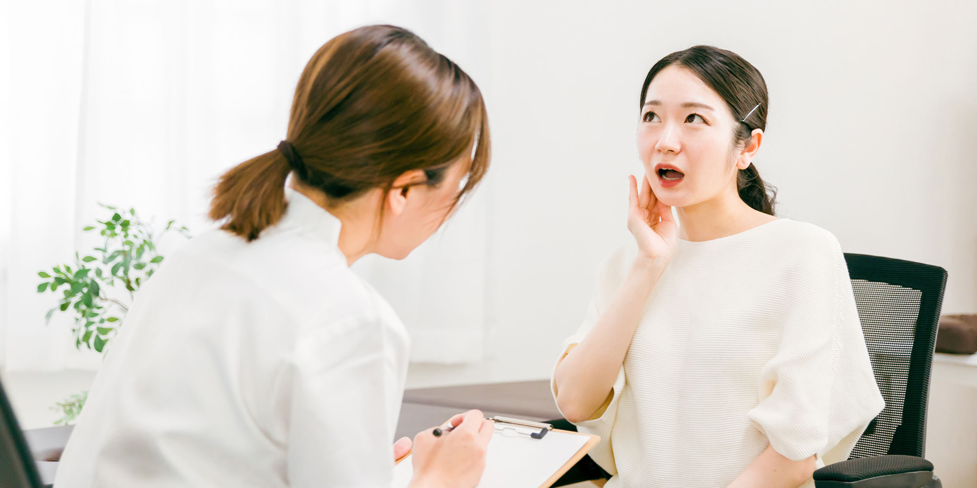 close up of patient having a jaw examination for their TMJ