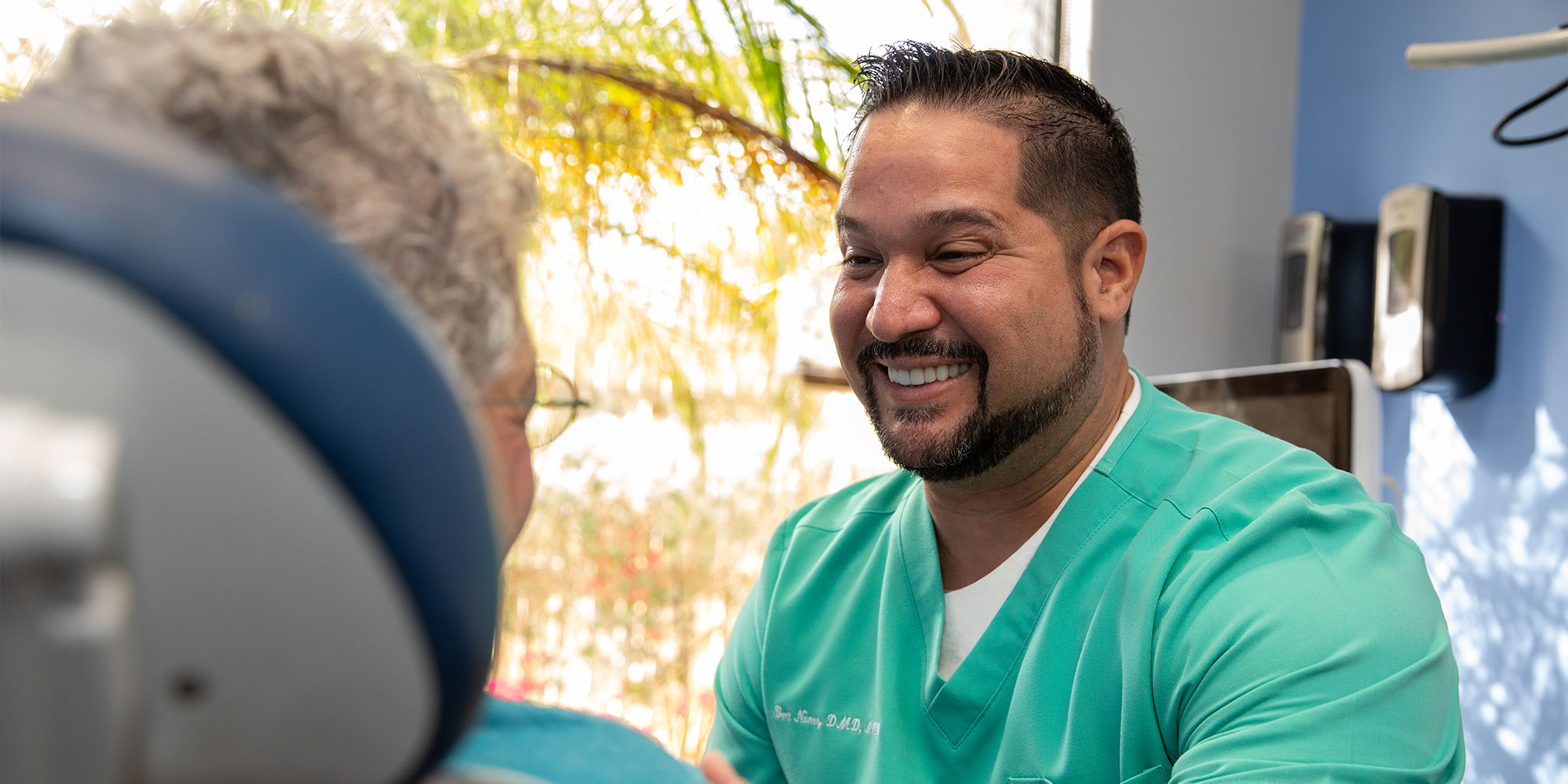 doctor smiling while going over dental procedure information