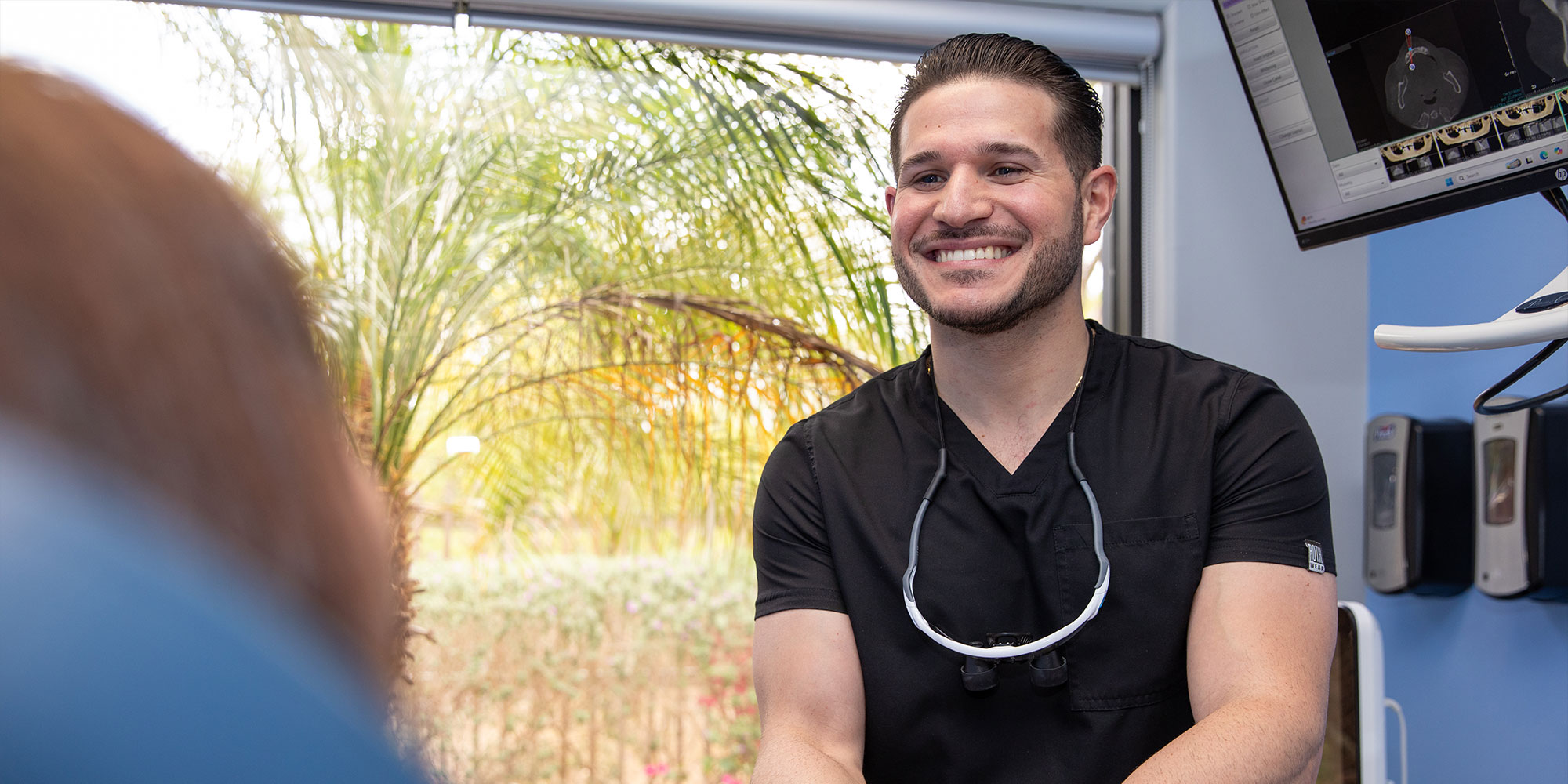 doctor helping patient go over dental procedure information