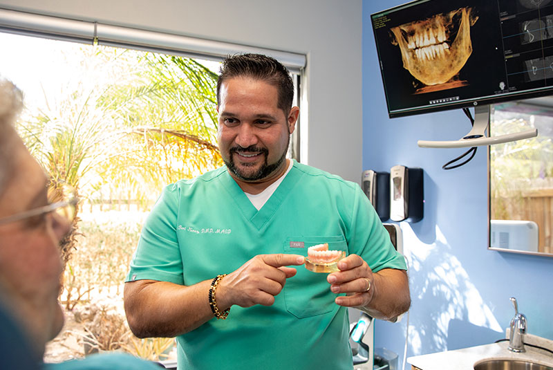 doctor going over dental procedure information with patient