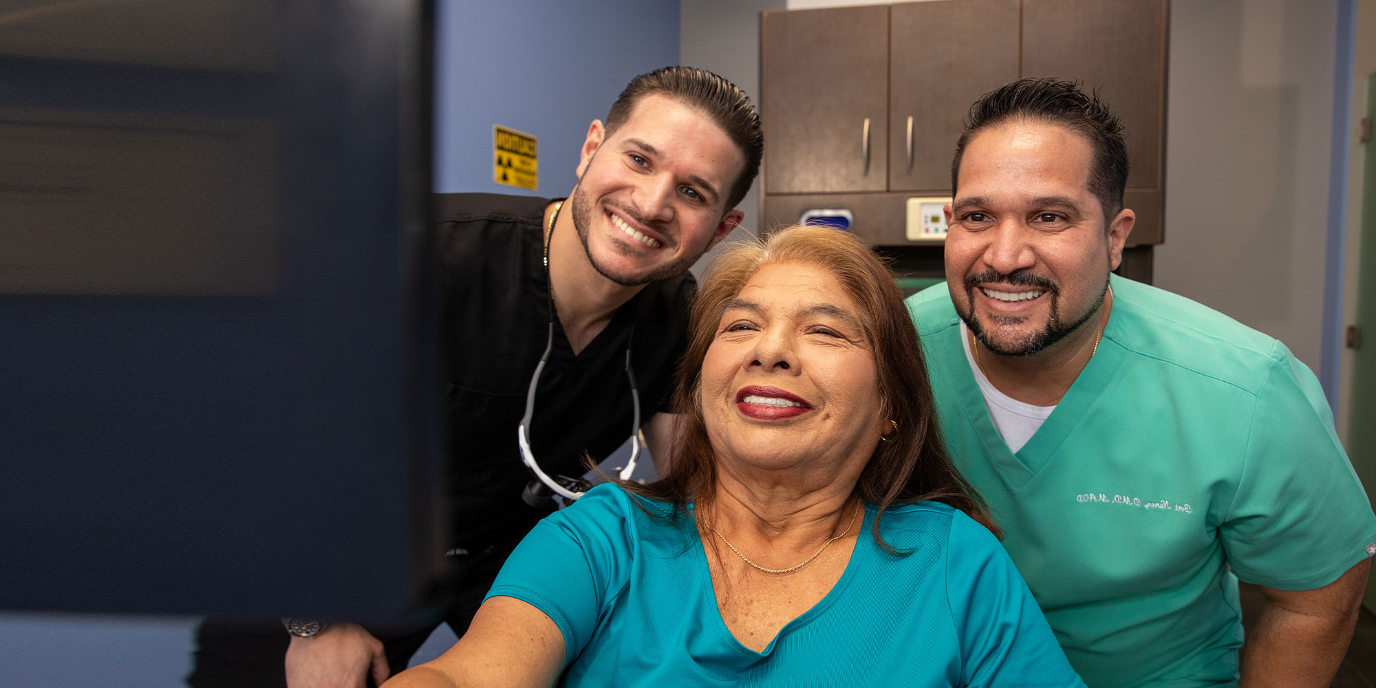 patient and doctor both smiling together after dental procedure
