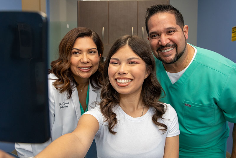 doctors and patient both smiling brightly